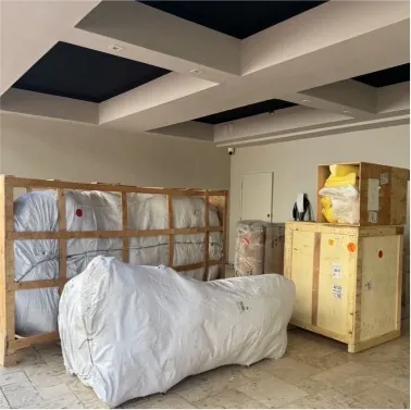 Wooden crates and padded items staged for a move